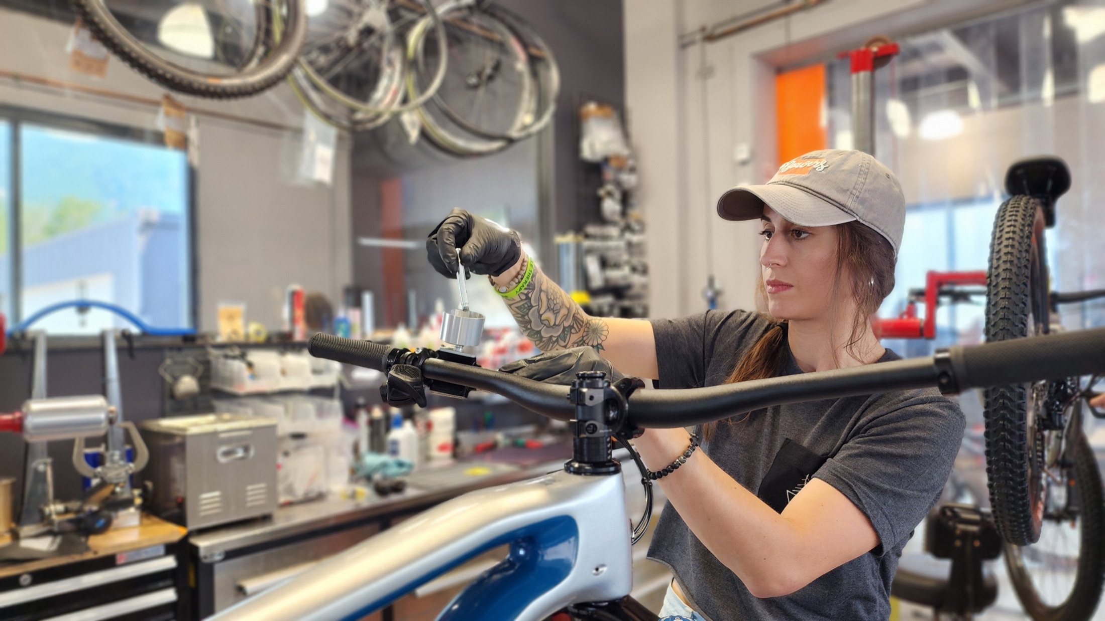 Isabella Taylor servicing a mountain bike in The Line's North Bend workshop.